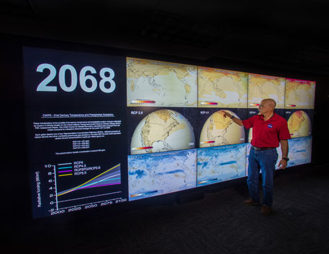 Photo of visualization wall/hyperwall showing temperature and precipitation projections for the year 2068